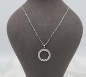 Silver-toned circular wreath pendant adorned with sparkling zircon stones.