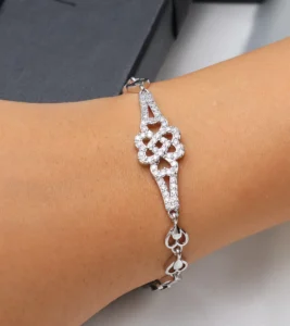 Silver-toned floral bracelet with zircon stones and adjustable fit.